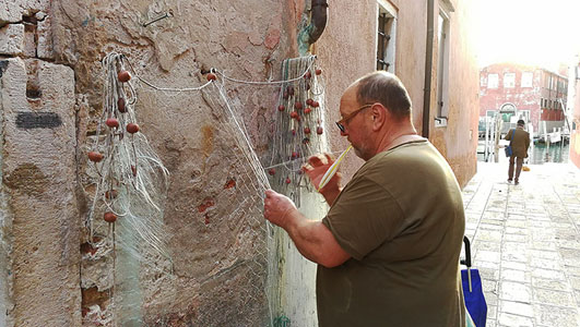 Ergo: Travel promotes the local way of life. like this very last of the Venetian fishermen who still used traditional methods of fishing. The last traditional fisherman in Venice